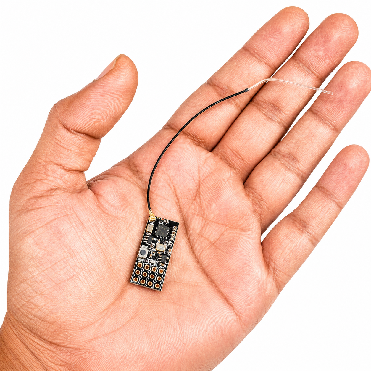 Flysky FS2A 4CH receiver shown in hand for size reference