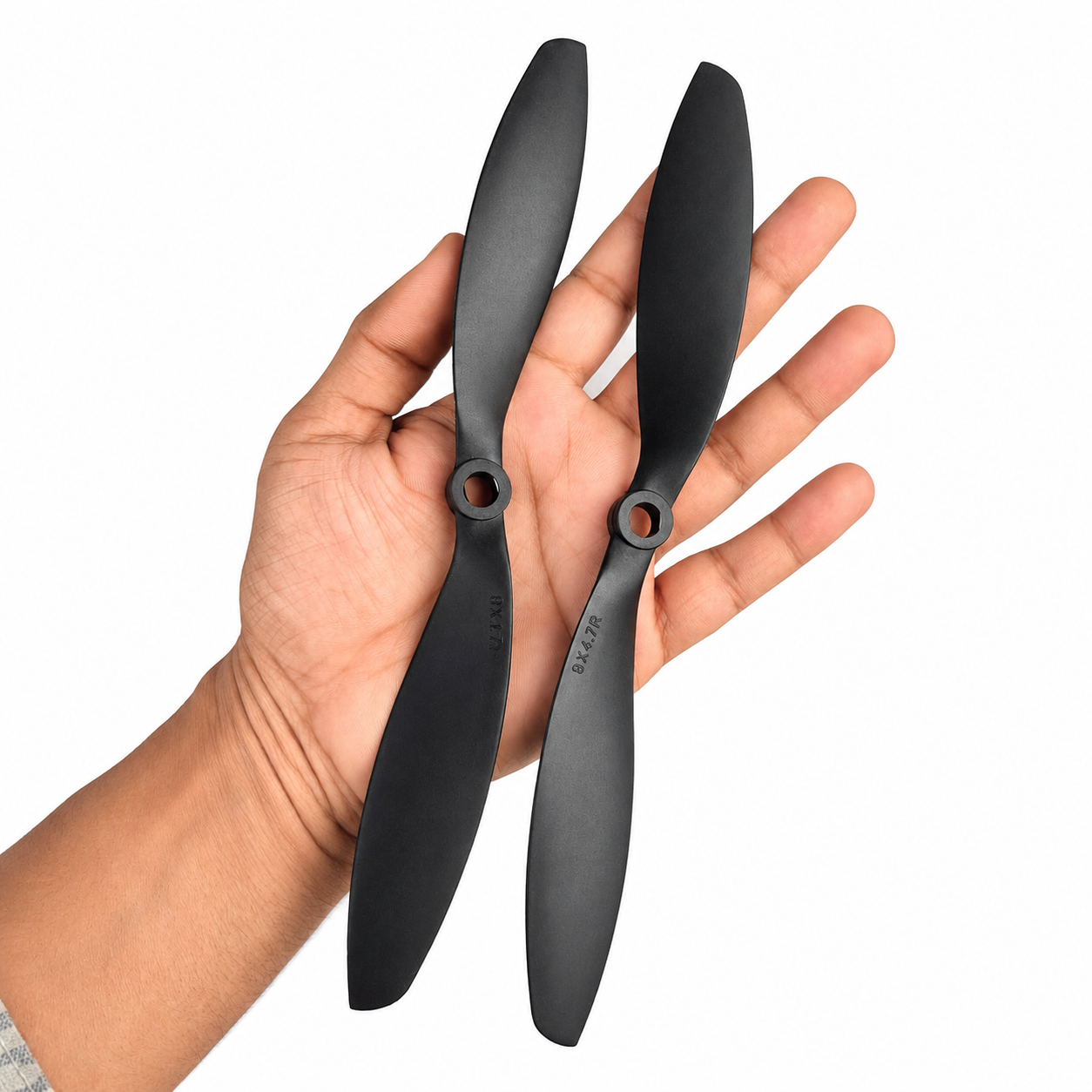 9047 DJI propeller shown in hand for size comparison