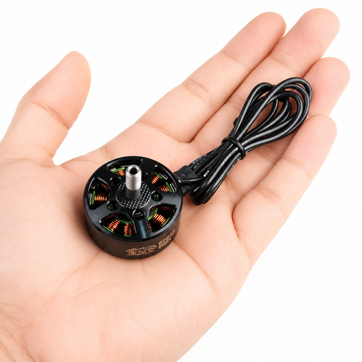 SURPASS HOBBY Bat B2810 980KV FPV Motor Held in Hand for Size Comparison