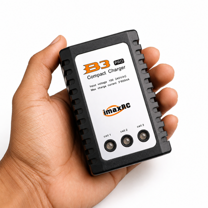 Hand holding the B3 2-3S LiPo Battery Balance Charger showing its compact design.
