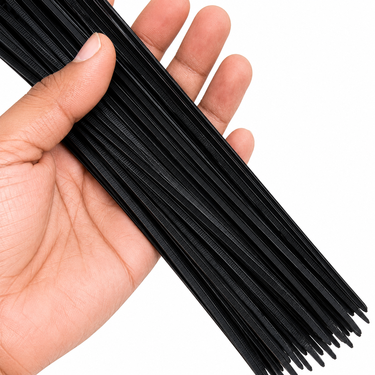 Black self locking cable ties held in hand