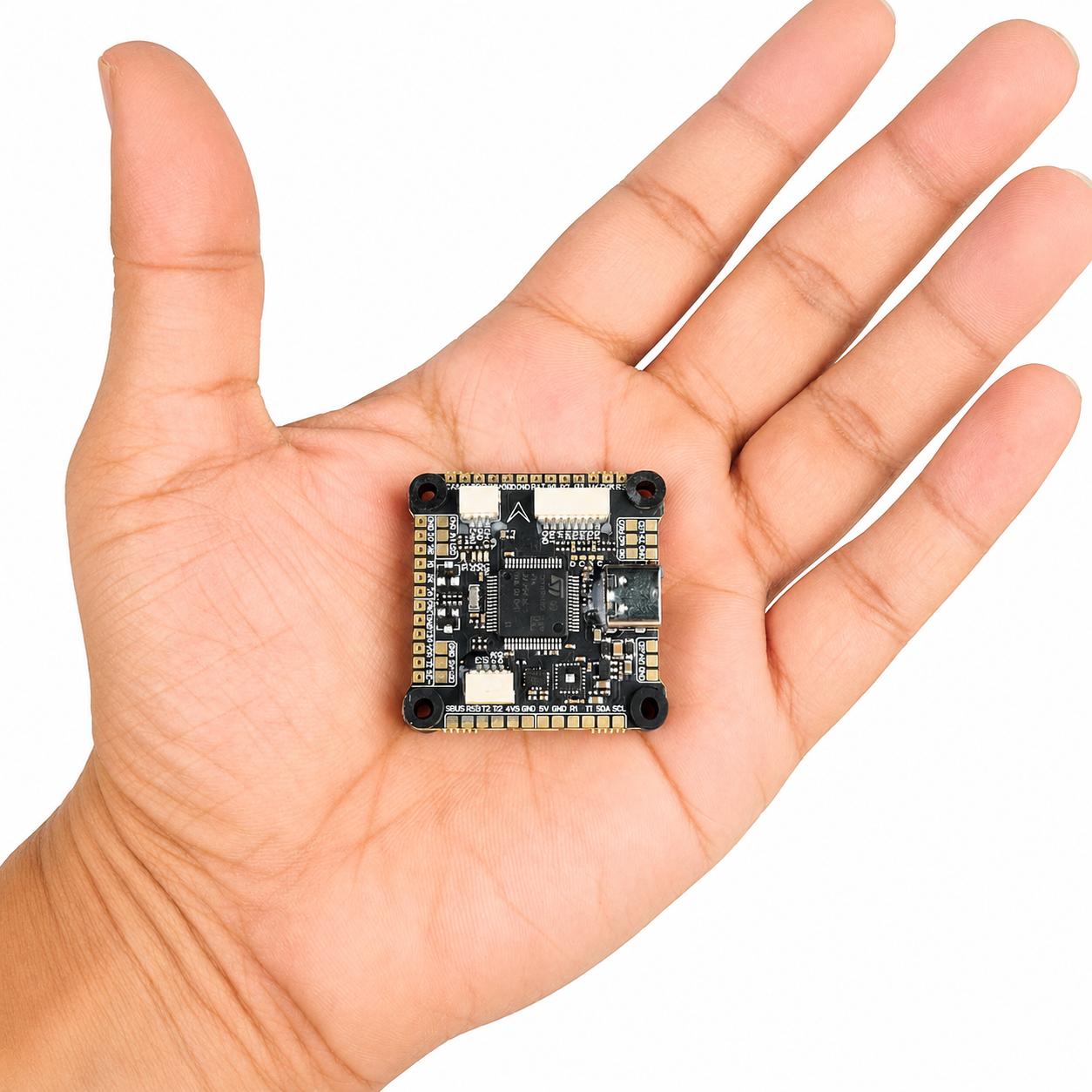 DakeFPV F405 flight controller size comparison in hand
