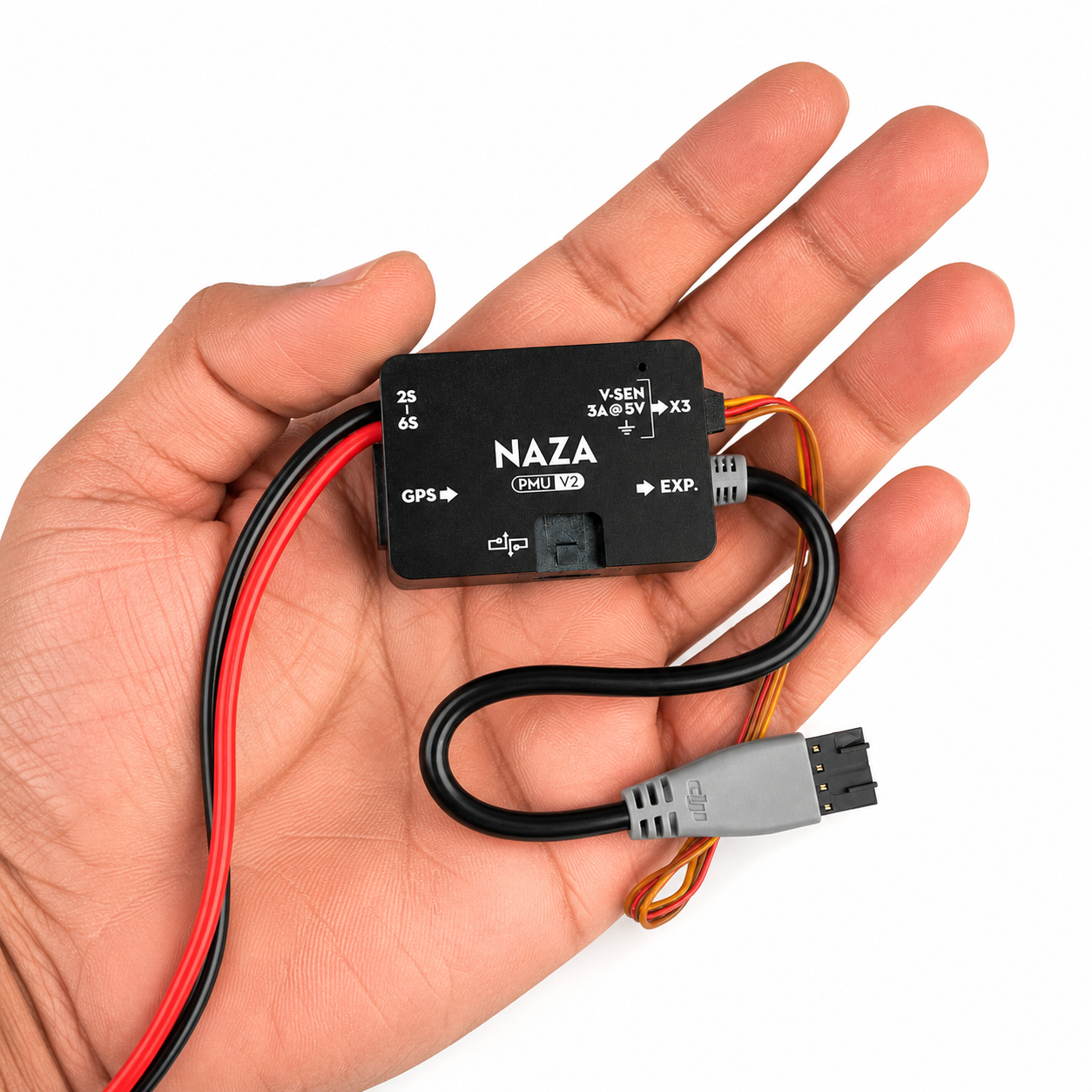 DJI NAZA V2 power module shown in hand for size comparison