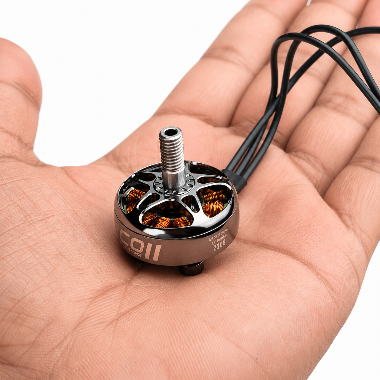 EMAX ECO 2306 1900KV FPV motor shown in hand for size reference