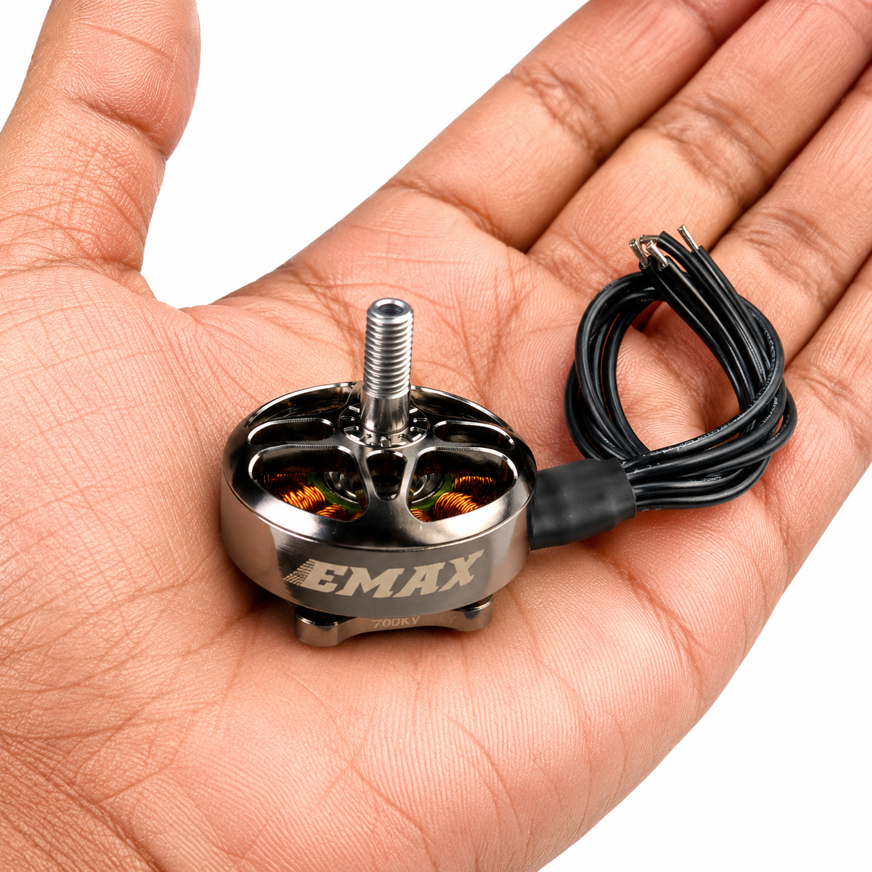 Emax ECOII 2807 brushless motor shown in hand for size comparison