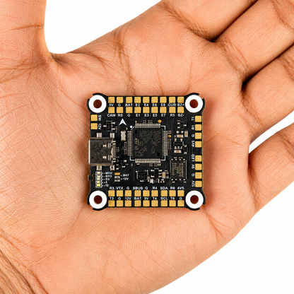 FlyfishRC F405 flight controller shown in hand for size reference