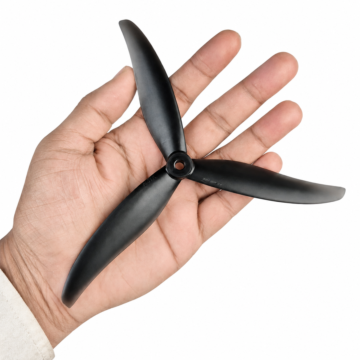  Gemfan HD 7037 Clear Black 3 Blade Propeller Held in Hand