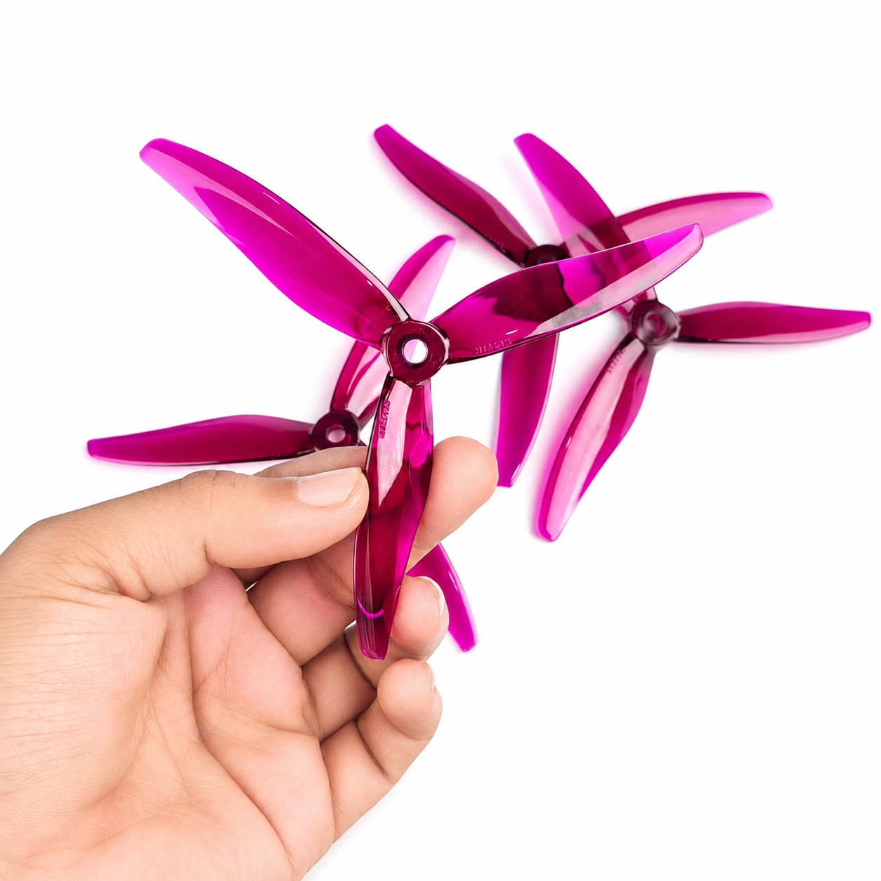 Gemfan Hurricane 51377 MAX Magenta Drone Propeller held in hand
