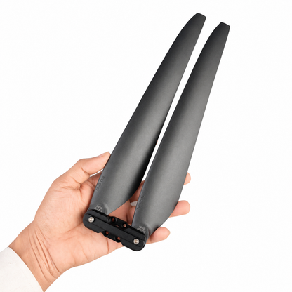 Hand holding Hobbywing X6 Plus 2480 Folding Propeller With Hub CW