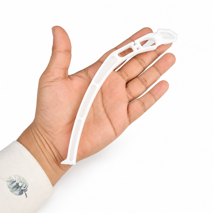 Lightweight white landing gear plastic shown in hand for size reference