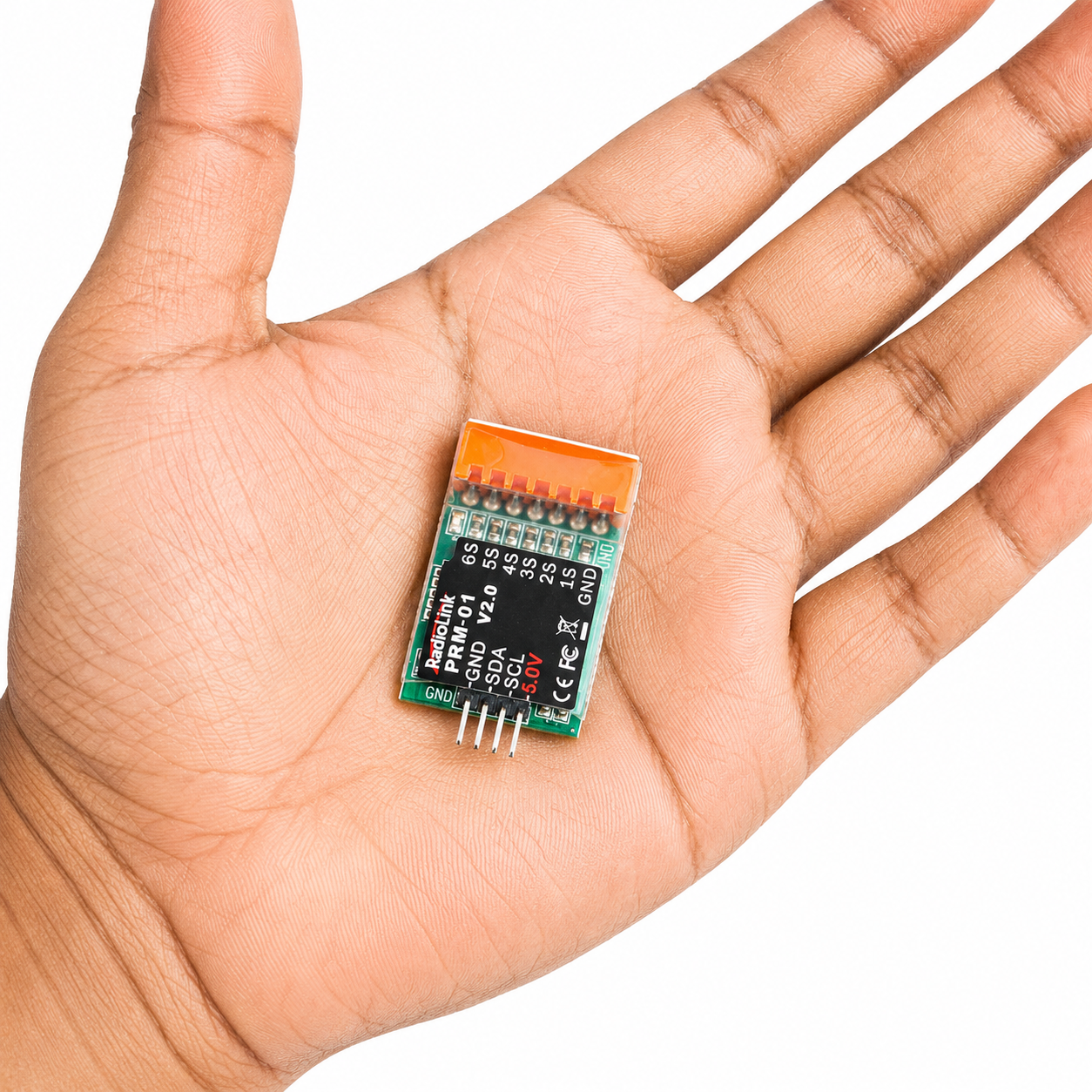 Radiolink PRM-01 telemetry module shown in hand