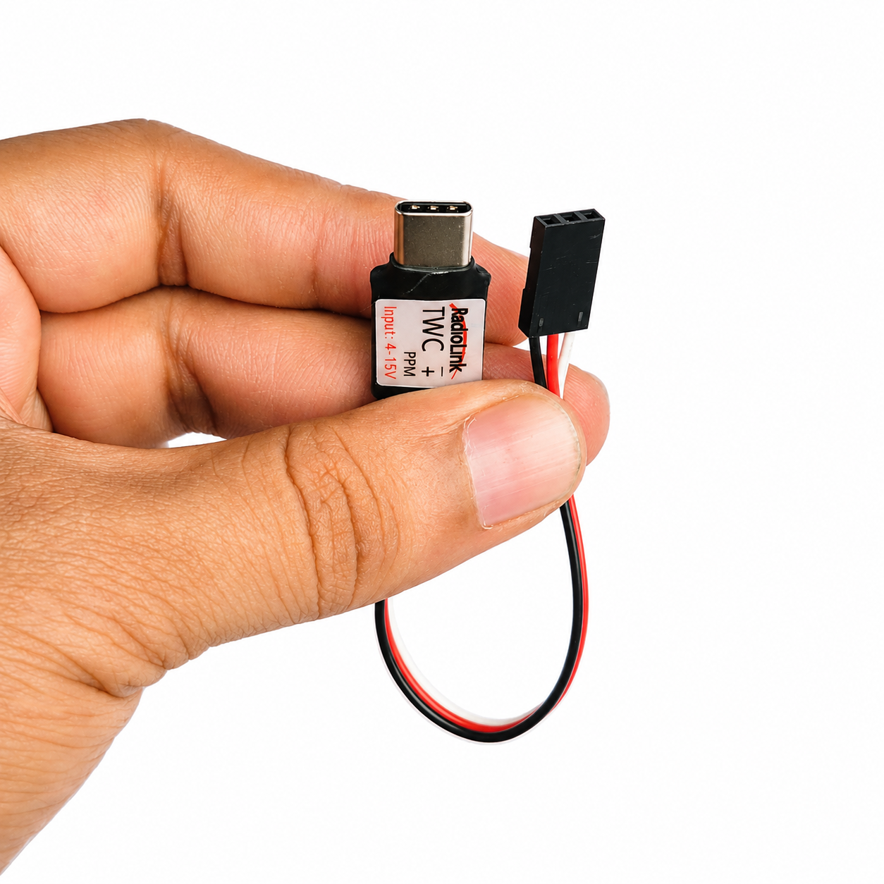 Radiolink TWC wireless trainer adapter held in hand