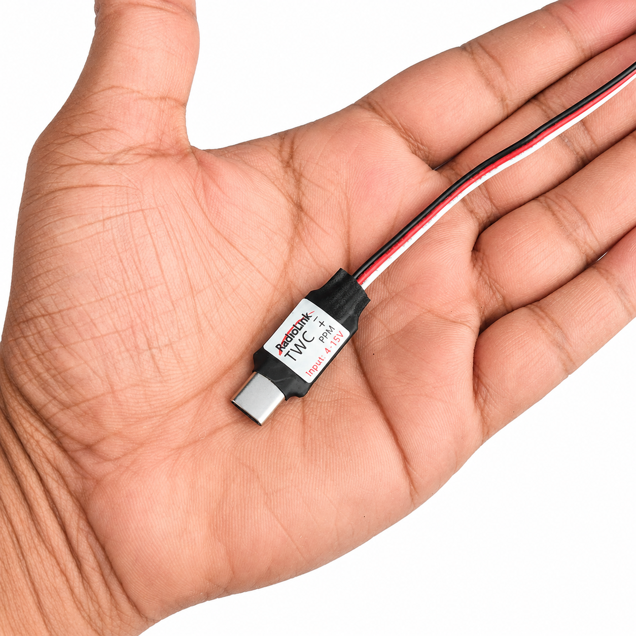 Compact Radiolink TWC wireless trainer cable shown in hand