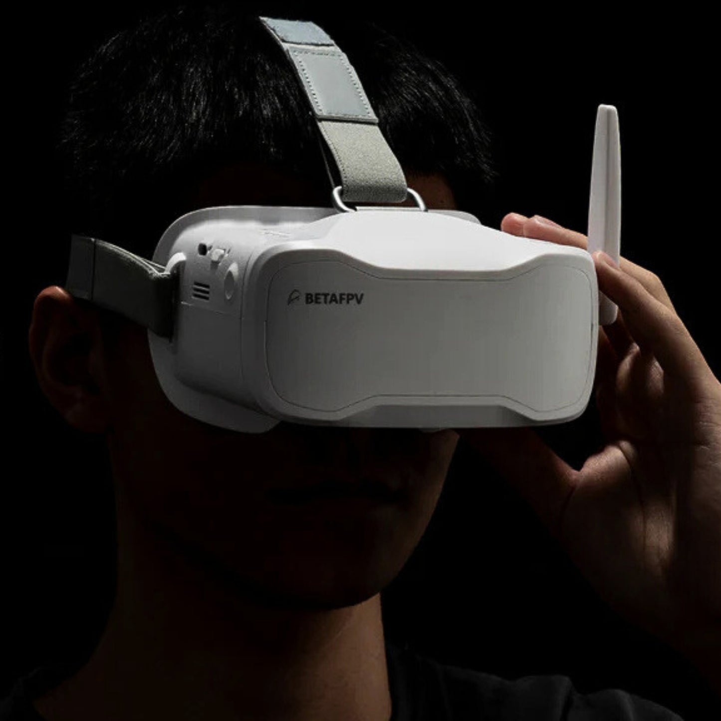 Pilot using BetaFPV VR03 FPV goggles during drone flight