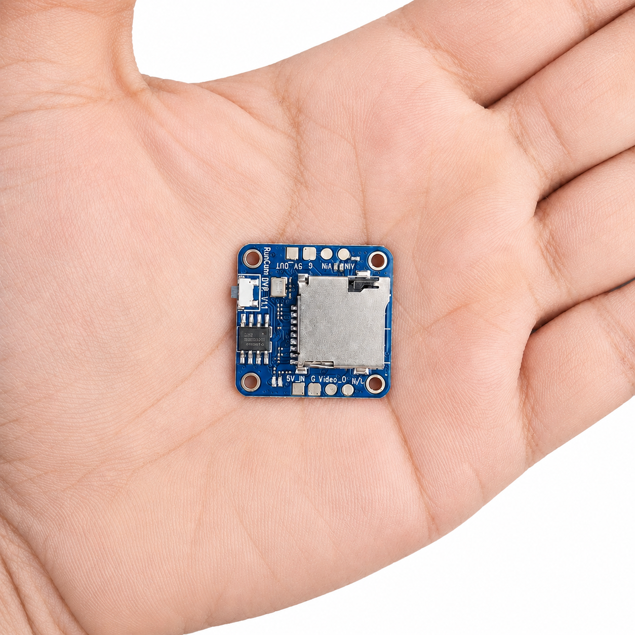 RunCam Mini FPV DVR shown in hand for size comparison