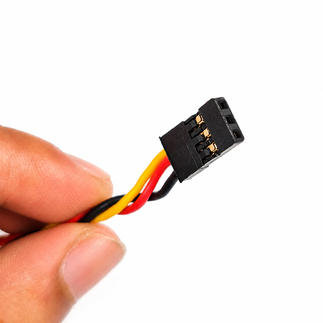 SafeConnect 15CM JR servo extension cable shown in hand for size reference