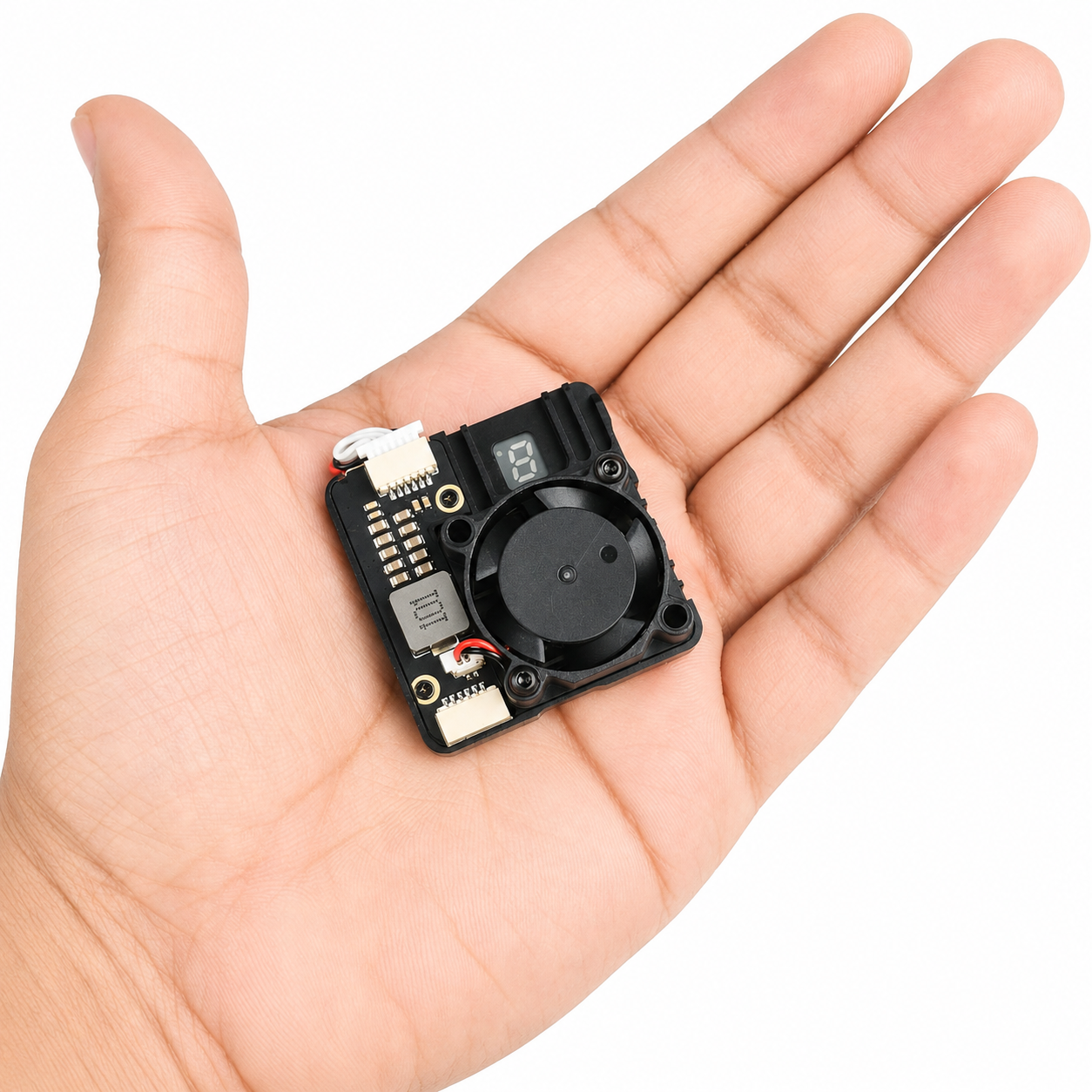 SKYZONE VT1225 2.5W VTX shown in hand for size comparison
