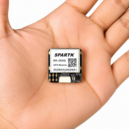 SPARTIK SK-252Q M10 GPS Module shown in hand for size reference, featuring QMC5883L compass for FPV drones and UAV navigation