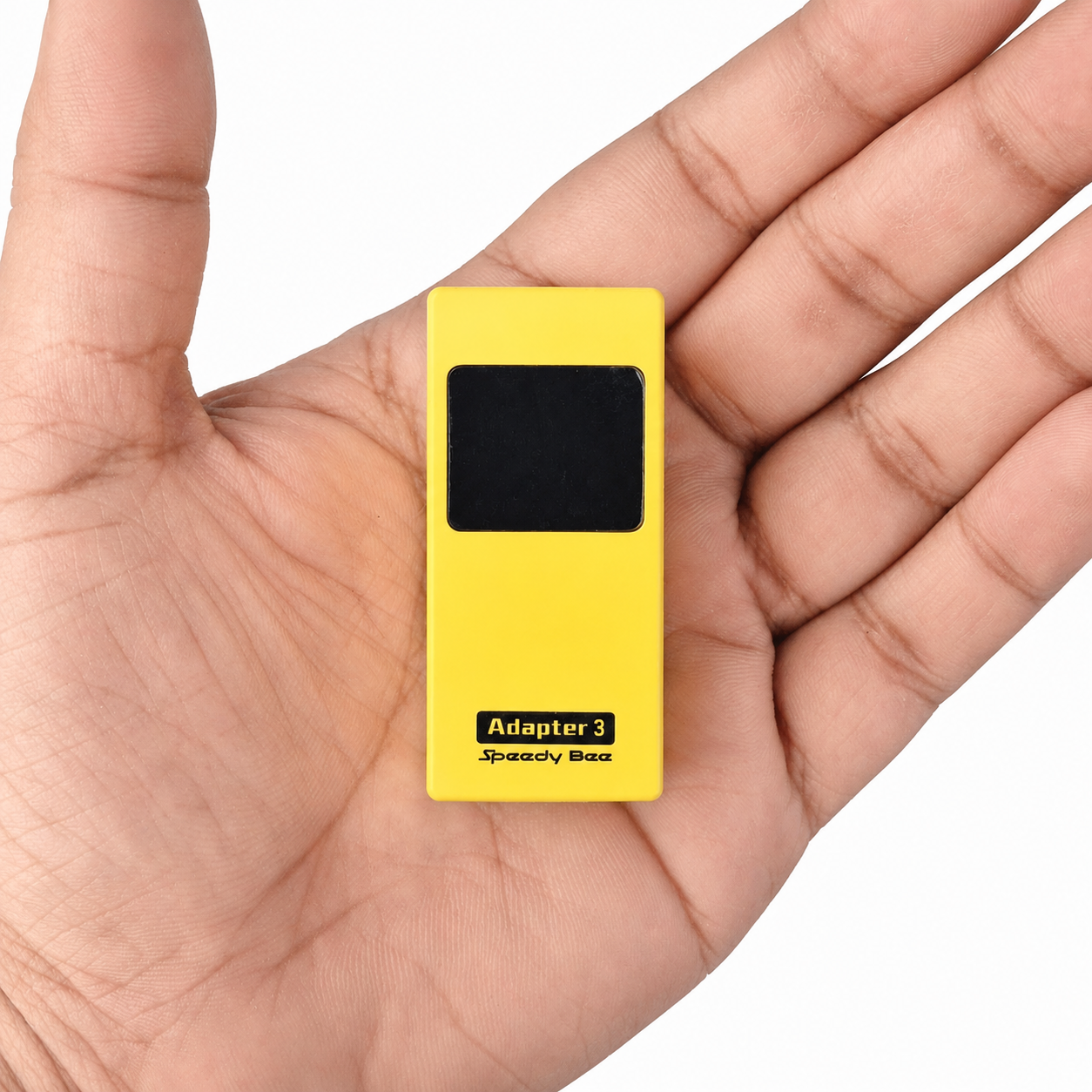 Compact SpeedyBee Adapter 3 carried in hand for portable FPV configuration