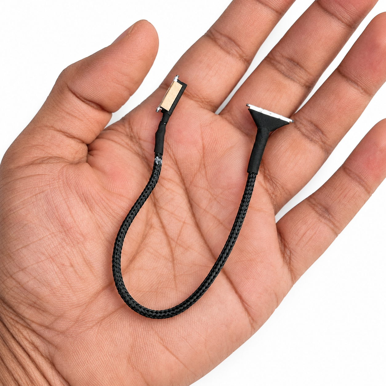 SpeedyBee DJI O3 coaxial cable shown in hand for size comparison