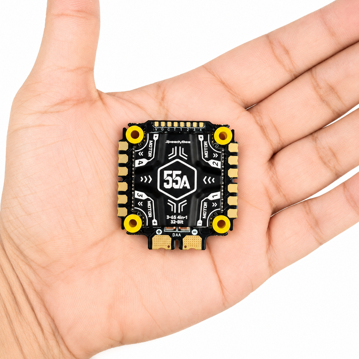 SpeedyBee F405 V5 OX32 55A 4 in 1 ESC shown in hand for size reference