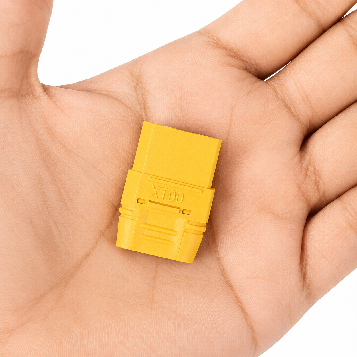 Amass XT90 female connector shown in hand for size reference.